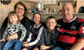 ?? EMMA DANGERFIEL­D/STUFF ?? The Francis family from Rangiora were upset when their right to use a valid disabled permit was questioned. Tara and Paul Francis, with their children Edie, 2, and Poppy and Jack, both 9.