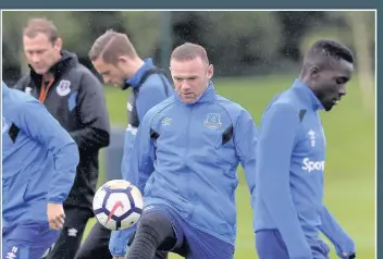  ??  ?? ON THE BALL Wayne Rooney put his off-field problems behind him to concentrat­e on training this week