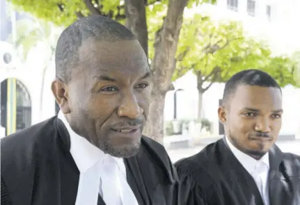  ??  ?? Defence attorneys Donald Bryan (left) and Alexander Shaw speaking with the media following the end of the summation in the Uchence Wilson gang trial yesterday at the Supreme Court in downtown Kingston.