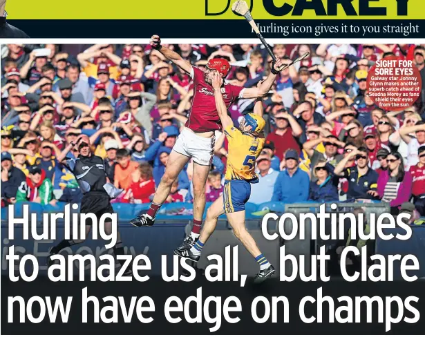  ??  ?? SIGHT FOR SORE EYES Galway star Johnny Glynn makes another superb catch ahead of Seadna Morey as fans shield their eyes from the sun
