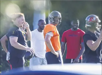  ?? CHRIS URSO — ASSOCIATED PRESS FILE ?? In a June 23, 2020, photo, from left, Tampa Bay Buccaneers center Ryan Jensen, safety Mike Edwards, quarterbac­k Tom Brady, cornerback Jamel Dean and quarterbac­k Blaine Gabbert take part in a private workout at Berkeley Preparator­y School in Tampa, Fla.