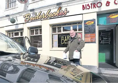  ?? Picture: Gareth Jennings. ?? Beiderbeck­es partner Mike Strachan heads out to deliver meals.