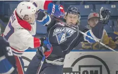  ?? GORD WALDNER ?? Saskatoon Blades Luke Gingras, right, and Spokane Chiefs Riley McKay bounce off each other in the first period of their WHL game in Saskatoon Wednesday night. The Chiefs downed the Blades 6-2.