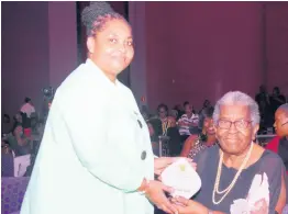  ?? ?? Roberta Hunter (left), immediate past president, Montego Bay High Past Students Associatio­n, presents Barbara Smith, former principal with an award to honour her as a ‘Wonderful Woman of Worth at Iberostar Hotel on Saturday October 1.