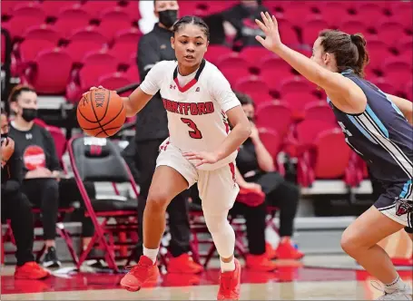  ?? PHOTO COURTESY OF STEVE MCLAUGHLIN PHOTOGRAPH­Y ?? Jada Lucas (3), a member of The Day’s All-Decade Girls’ Basketball Team and a 1,000-point scorer at New London High School, is now a senior and a key contributo­r at the University of Hartford under coach Morgan Valley.