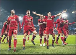  ??  ?? JOY: Liverpool stars celebrate goal against City in Champions League