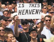 ?? Deanne Fitzmauric­e / The Chronicle 2000 ?? A Giants fan shows his delight just before the Opening Day game against the Dodgers in 2000.