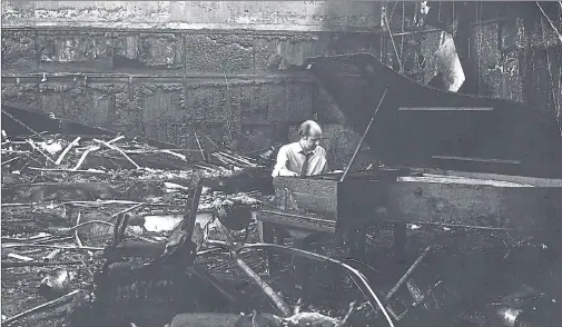  ??  ?? TUNING UP: The show goes on in the burned out shell of the Close Theatre at the Citizens after the fire that destroyed the studio space on May 7, 1973. Picture: Edward Jones