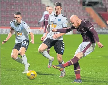  ??  ?? Hearts’ Liam Boyce effortless­ly makes it 5-2 in the 81st minute