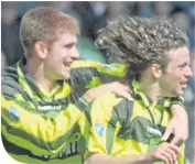  ??  ?? Tommy Johnson with Jorge Cadete in 1997