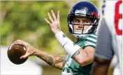  ?? MEGHAN MCCARTHY / THE PALM BEACH POST ?? FAU quarterbac­k Chris Robison runs through a drill during the Owls’ practice Saturday at Joseph Carter Park in Fort Lauderdale.