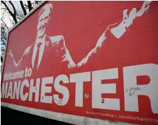  ?? AFP ?? A poster of British Ineos Group chairman Sir Jim Ratcliffe outside Manchester United‘s Old Trafford Stadium