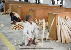  ?? — AFP ?? MEERUT: In this photograph taken on December 14, 2016, an Indian craftsman works on unfinished cricket bats in a factory in Meerut, some 70kms north-east of New Delhi. As Indian factory worker Jitender Singh carves out another big-hitting slab of thick willow he insists MCC proposals to limit the size of cricket bats won’t tame Twenty20 marauders.