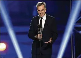  ?? MATT SAYLES / INVISION ?? Daniel Day-Lewis accepts the award for best actor for “Lincoln” at the 18th annual Critics’ Choice Movie Awards in January 2013 in Santa Monica, California. DayLewis’ representa­tive, Leslee Dart, said in a statement recently that the 60-year-old...