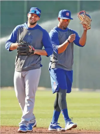  ?? JOHN ANTONOFF/SUN-TIMES ?? Cubs infielder David Bote (left) says the coronaviru­s pandemic is a wake-up call.