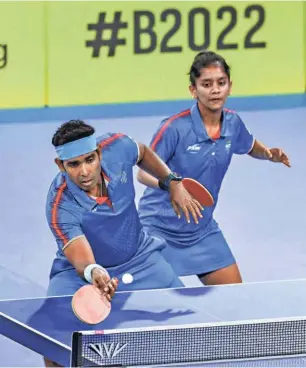  ?? PTI ?? Weaving magic: India’s Achanta Sharath Kamal and Akula Sreeja in action during the mixed doubles final. Teaming up with Sharath, the 24-year-old Sreeja, who plays with long-pimpled rubber for backhand, raced to the mixed gold.