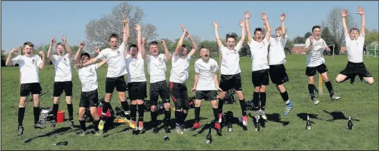  ??  ?? Burbage junior football team celebrate success gaining promotion six years after the team was set up by three dads who wanted a team for their kids