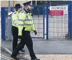  ??  ?? PRESENCE Officers at school yesterday