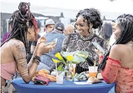  ?? ?? Guests dine and drink at the previous Creole Food Festival.