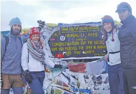  ??  ?? Jacinda Cole (top, second right) and friends while trekking in the Annapurna Mountains.