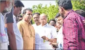  ?? —PTI ?? NCP chief Sharad Pawar talks with farmers during his visit to Khapa village to inspect damaged crops, in Nagpur.