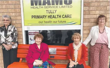  ??  ?? SPECIAL SEAT: Tully Lioness Club members Helen Mullins, Marie Day, Shirley Casey and Val Bradley with the club’s new Red Bench at Tully’s Mamu Health Service clinic.