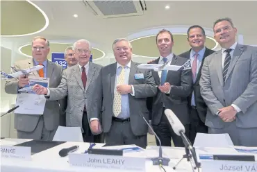  ?? AP ?? FROM LEFT Barry Biffle, CEO of Frontier Airlines, Barry Eccleston, president of Airbus Americas, Bill Franke, managing partner of Indigo Partners, John Leahy, sales chief of Airbus SE, Jozsef Varadi, CEO of Wizz Air, Enrique Beltranena, founder and CEO...