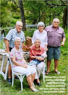  ??  ?? Siblings Percy, Gayle and Ken (standing) with Percy’s wife, Maureen, and their 100-year-old mum, Josie, nursing baby Carlee.