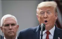  ?? DREW ANGERER/GETTY IMAGES ?? Vice President Mike Pence looks on as President Donald Trump declares a national emergency while at the White House in Washington, D.C., on Friday.