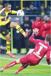  ??  ?? DORTMUND: Dortmund’s French defender Abdou Diallo and Hoffenheim’s German goalkeeper Oliver Baumann vie for the ball during the German first division Bundesliga football match Borussia Dortmund vs TSG Hoffenheim in Dortmund, western Germany, yesterday. — AFP