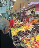  ??  ?? CHERRY PICKING In the Valencia Central Market.