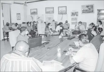  ??  ?? GWI CEO Shaik Baksh (seated at head of table) engages GWI’s managers from across the country at the meeting yesterday