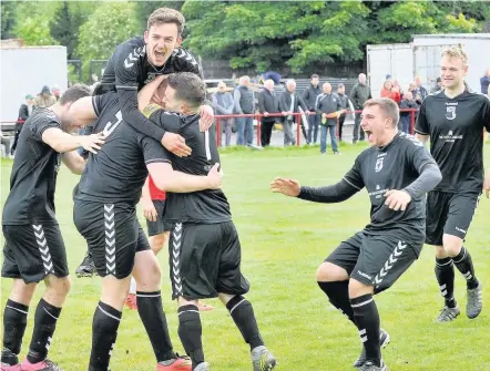  ??  ?? Sheer joy East Kilbride Thistle players mob hero Ross Gillan after he netted their only goal of the game against Newmains