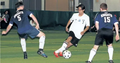  ?? SUPPLIED PHOTO ?? Governor Simcoe's Oti Frigole, with the ball, is defended by Sir Winston Churchill's Henry Allan, No. 5, and DSBN Academy's Zach Harrietha, No, 15, at in the fourth annual Niagara Region Soccer Showcase inside the dome at Youngs Sportsplex Wednesday...