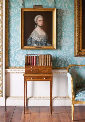  ??  ?? ABOVE Thomas Gainsborou­gh’s portrait of Isabella Byron, the unconventi­onal mother of the 5th Earl, and great-aunt of the poet, Lord Byron LEFT A vast mahogany china cabinet was installed and enlarged on the China Landing in the 1880s to display over...