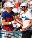  ??  ?? Well done, you: Murray congratula­tes Thompson after his shock victory
