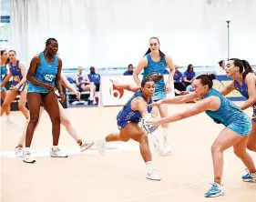  ?? PICTURE: Will Cooper/Fever Pitch ?? Team Bath Netball (blue & yellow) in action during their defeat at home to Surrey Storm