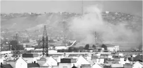  ?? PHOTO: AP ?? Smoke rises from an explosion outside the airport in Kabul