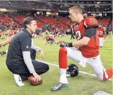  ?? JOHN BAZEMORE/ASSOCIATED PRESS ?? Atlanta Falcons offensive coordinato­r Kyle Shanahan, left, talks with quarterbac­k Matt Ryan before a December game.