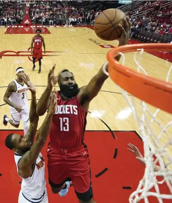  ?? AP FIle ?? BACK TO WORK: James Harden (13) of the Houston Rockets made his first appearance at training camp on Monday.