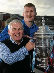  ??  ?? Derek Prendergas­t, then captain of Drogheda United, gets his hands on the FAI Cup with manager Mick Cooke ahead of the 2013 final with Sligo Rovers at Aviva Stadium.