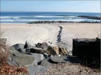  ?? WAYNE PARRY — THE ASSOCIATED PRESS ?? This photo shows boulders leading down to the beach in Deal, N.J. on a street end that the town plans to give up to a private property owner.