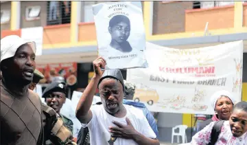  ?? PICTURE: THOBILE MATHONSI ?? CRY FOR JUSTICE: Comrades and friends of former MK combatant Nokuthula Simelane singing outside the Pretoria Magistrate’s Court where the four men accused of her murder appeared.