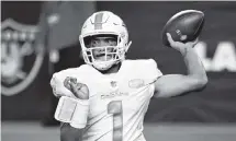  ?? DAVID BECKER AP ?? Most of the NFL evaluators say Dolphins quarterbac­k Tua Tagovailoa needs better playmakers around him on offense.