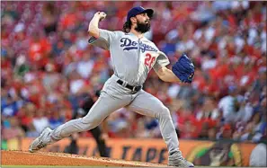  ?? ?? Los Angeles Dodgers’ Tony Gonsolin throws during the first inning of a baseball game against the Cincinnati Reds in Cincinnati on Tuesday.