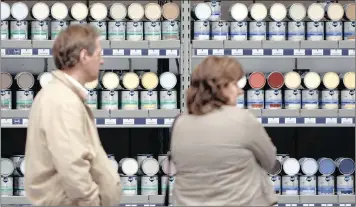  ?? PHOTO: BLOOMBERG ?? Customers choose from Akzo Nobel paints on sale at Thiry Paints store in Brussels, Belgium. Akzo Nobel yesterday rejected a €22.4 billion takeover offer from PPG Industries, its biggest US competitor.