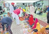  ?? SOURCED ?? Uttar Pradesh BJP chief Swatantra Dev Singh lighting 71 diyas at Hanuman Setu temple on the occasion of PM’s birthday in Lucknow on Friday and (right) UP minister Mahendra Singh serving food at a community feast.