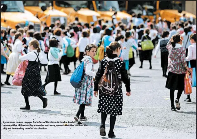  ?? AP ?? As summer camps prepare for influx of kids from Orthodox Jewish communitie­s hit hardest by a measles outbreak, several counties north of the city are demanding proof of vaccinatio­n.