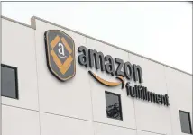  ?? ELLEN M. BANNER / SEATTLE TIMES ?? While other retailers are shedding jobs, Amazon is hiring workers to keep up with massive growth. Next week’s job fairs will help Amazon snag workers before the holidays.
