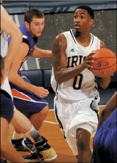  ?? JOE RAYMOND / ASSOCIATED PRESS ?? Notre Dame guard Eric Atkins drives the lane past Evansville’s Lewis Jones during the season-opener for both teams. The Irish won 58-49.